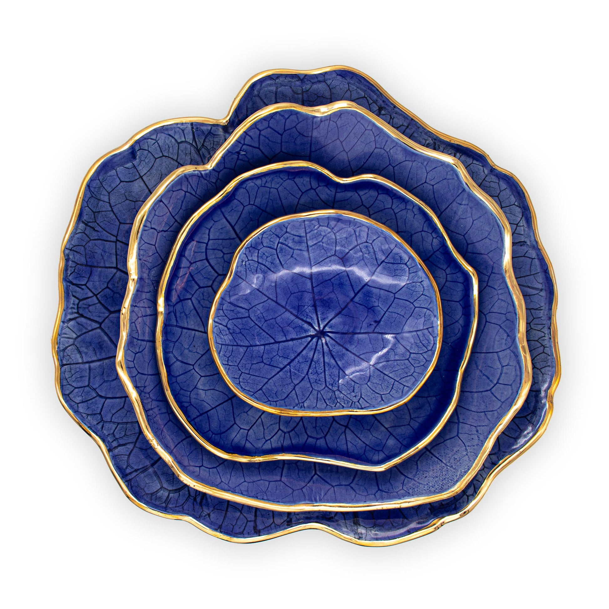 Ballad Ceramics Nasturtium Leaf Impression Dinnerware Set in blue with all sizes stacked